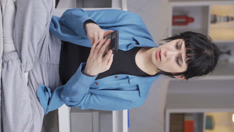 Vertical-video-of-Disappointed-young-woman-in-messaging.